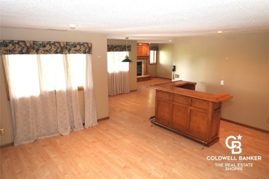 Enjoy peaceful evenings on your covered back deck overlooking on The Golf Club At Southwind in Kansas - for sale on GolfHomes.com, golf home, golf lot