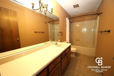 Enjoy peaceful evenings on your covered back deck overlooking on The Golf Club At Southwind in Kansas - for sale on GolfHomes.com, golf home, golf lot