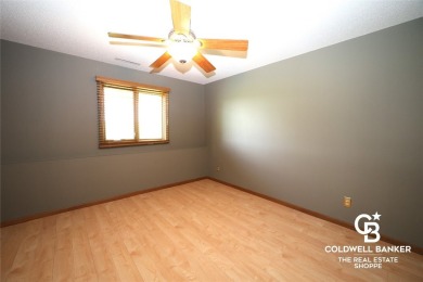 Enjoy peaceful evenings on your covered back deck overlooking on The Golf Club At Southwind in Kansas - for sale on GolfHomes.com, golf home, golf lot