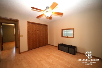 Enjoy peaceful evenings on your covered back deck overlooking on The Golf Club At Southwind in Kansas - for sale on GolfHomes.com, golf home, golf lot