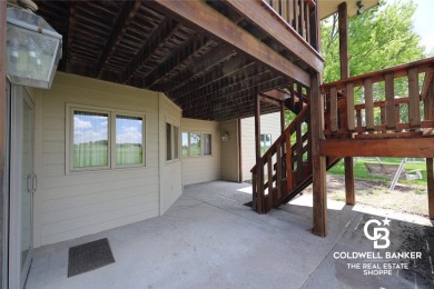 Enjoy peaceful evenings on your covered back deck overlooking on The Golf Club At Southwind in Kansas - for sale on GolfHomes.com, golf home, golf lot