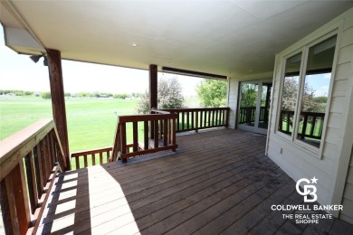Enjoy peaceful evenings on your covered back deck overlooking on The Golf Club At Southwind in Kansas - for sale on GolfHomes.com, golf home, golf lot