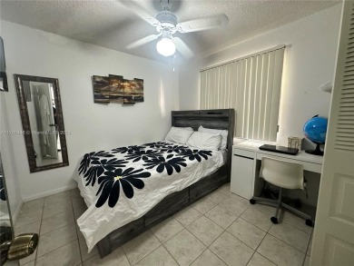 GREAT AND HIGHLY SOUGHT AFTER GROUND FLOOR 2/2 UNIT! ALL TILES on Sunrise Lakes Phase IV Golf Course in Florida - for sale on GolfHomes.com, golf home, golf lot
