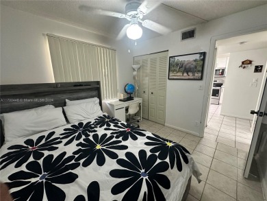GREAT AND HIGHLY SOUGHT AFTER GROUND FLOOR 2/2 UNIT! ALL TILES on Sunrise Lakes Phase IV Golf Course in Florida - for sale on GolfHomes.com, golf home, golf lot