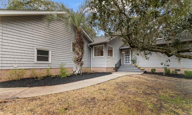 Lovely contemporary style home here at 75 Duckpond Place in on Wedgefield Plantation Golf Club in South Carolina - for sale on GolfHomes.com, golf home, golf lot