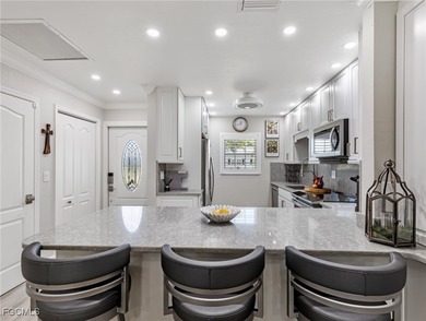 Enjoy golf course views from your spacious lanai! This inviting on Myerlee Country Club in Florida - for sale on GolfHomes.com, golf home, golf lot