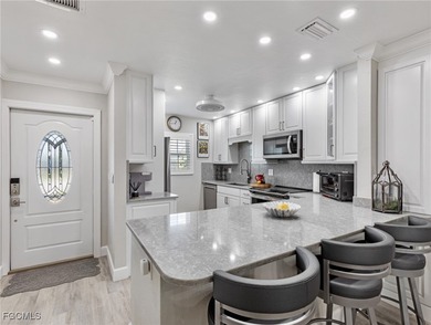 Enjoy golf course views from your spacious lanai! This inviting on Myerlee Country Club in Florida - for sale on GolfHomes.com, golf home, golf lot