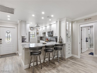 Enjoy golf course views from your spacious lanai! This inviting on Myerlee Country Club in Florida - for sale on GolfHomes.com, golf home, golf lot