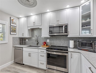 Enjoy golf course views from your spacious lanai! This inviting on Myerlee Country Club in Florida - for sale on GolfHomes.com, golf home, golf lot