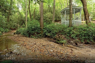 Discover the idyllic mountain charm of this four-bedroom on Sapphire National Golf Club in North Carolina - for sale on GolfHomes.com, golf home, golf lot