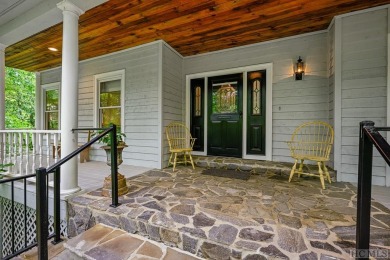 Discover the idyllic mountain charm of this four-bedroom on Sapphire National Golf Club in North Carolina - for sale on GolfHomes.com, golf home, golf lot