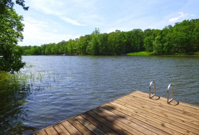 Built for comfort and ease of living, this home on Lake Navajo on Cherokee Village North Course in Arkansas - for sale on GolfHomes.com, golf home, golf lot
