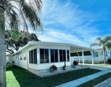 This beautifully furnished and extensively renovated two-bedroom on Fairway Village Golf Course in Florida - for sale on GolfHomes.com, golf home, golf lot