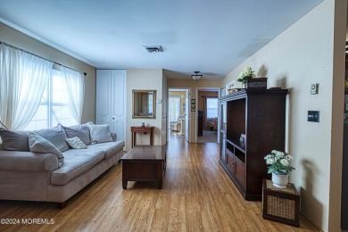 This is a lovely 2-bedroom, 1-bathroom end unit Greenbriar Model on Four Seasons Spa and Country Club in New Jersey - for sale on GolfHomes.com, golf home, golf lot