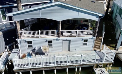 Your Coastal Retreat awaits! Waterfront 2bd/2ba move-in ready on Long Island Golf Course in Texas - for sale on GolfHomes.com, golf home, golf lot