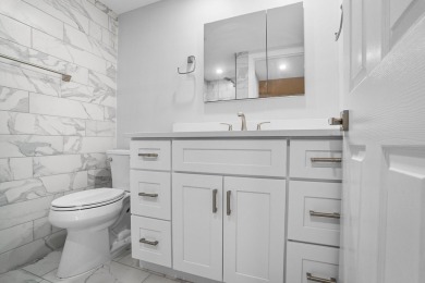 Stunning fully renovated corner unit in the gated 55+ Kings on Kings Point Golf -Flanders Way in Florida - for sale on GolfHomes.com, golf home, golf lot