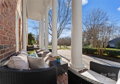 This distinctive home offers six bedrooms and five and a half on Providence Country Club in North Carolina - for sale on GolfHomes.com, golf home, golf lot