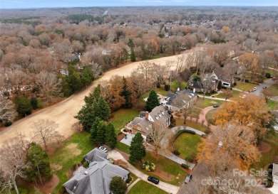 This distinctive home offers six bedrooms and five and a half on Providence Country Club in North Carolina - for sale on GolfHomes.com, golf home, golf lot