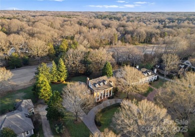 This distinctive home offers six bedrooms and five and a half on Providence Country Club in North Carolina - for sale on GolfHomes.com, golf home, golf lot