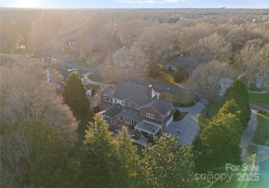 This distinctive home offers six bedrooms and five and a half on Providence Country Club in North Carolina - for sale on GolfHomes.com, golf home, golf lot