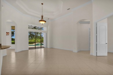 STUNNING POOL HOME WITH SWEEPING GOLF COURSE VIEW IN PGA on PGA Golf Club in PGA Village in Florida - for sale on GolfHomes.com, golf home, golf lot