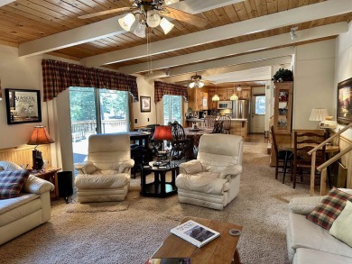 This beautifully maintained cabin features a spacious open floor on Lake Almanor Country Club in California - for sale on GolfHomes.com, golf home, golf lot
