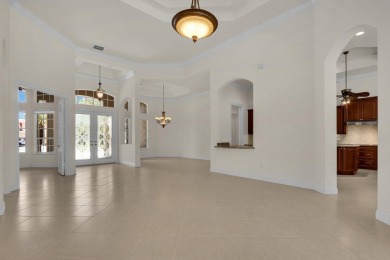 STUNNING POOL HOME WITH SWEEPING GOLF COURSE VIEW IN PGA on PGA Golf Club in PGA Village in Florida - for sale on GolfHomes.com, golf home, golf lot