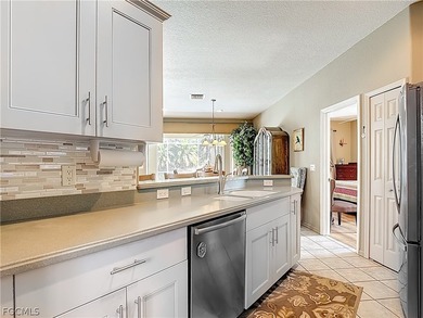 This OVERSIZED Ibis II POOL HOME with a private PRESERVE VIEW in on Herons Glen Golf and Country Club in Florida - for sale on GolfHomes.com, golf home, golf lot