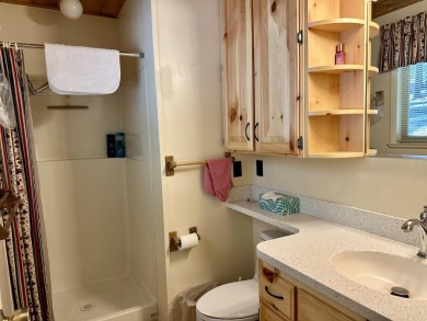 This beautifully maintained cabin features a spacious open floor on Lake Almanor Country Club in California - for sale on GolfHomes.com, golf home, golf lot