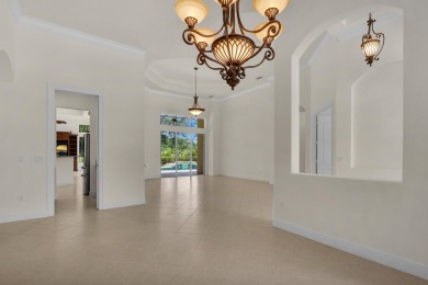 STUNNING POOL HOME WITH SWEEPING GOLF COURSE VIEW IN PGA on PGA Golf Club in PGA Village in Florida - for sale on GolfHomes.com, golf home, golf lot