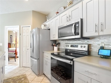 This OVERSIZED Ibis II POOL HOME with a private PRESERVE VIEW in on Herons Glen Golf and Country Club in Florida - for sale on GolfHomes.com, golf home, golf lot