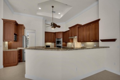 STUNNING POOL HOME WITH SWEEPING GOLF COURSE VIEW IN PGA on PGA Golf Club in PGA Village in Florida - for sale on GolfHomes.com, golf home, golf lot