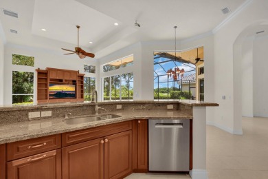 STUNNING POOL HOME WITH SWEEPING GOLF COURSE VIEW IN PGA on PGA Golf Club in PGA Village in Florida - for sale on GolfHomes.com, golf home, golf lot