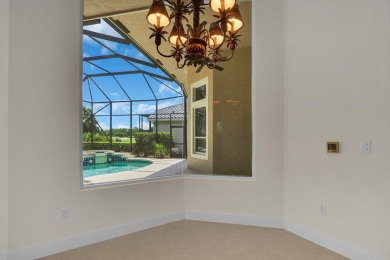 STUNNING POOL HOME WITH SWEEPING GOLF COURSE VIEW IN PGA on PGA Golf Club in PGA Village in Florida - for sale on GolfHomes.com, golf home, golf lot