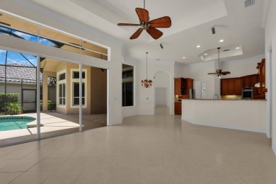STUNNING POOL HOME WITH SWEEPING GOLF COURSE VIEW IN PGA on PGA Golf Club in PGA Village in Florida - for sale on GolfHomes.com, golf home, golf lot