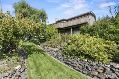 Discover peace, privacy, and panoramic beauty in this 3-bedroom on Hangman Valley Golf Course in Washington - for sale on GolfHomes.com, golf home, golf lot