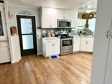 Situated on a spacious corner lot, this home features an on Lake Fairways Country Club in Florida - for sale on GolfHomes.com, golf home, golf lot