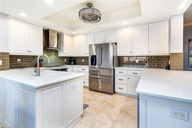 Perched high on the 12th floor in Jasmine Bay South, this on West Bay Beach and Golf Club in Florida - for sale on GolfHomes.com, golf home, golf lot