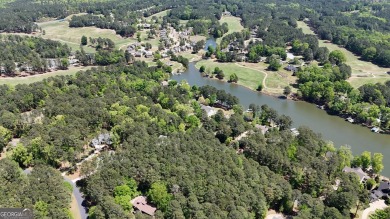 THIS IS A MEMBERSHIP AVAILABLE LOT - Wooded gently sloping to on Reynolds Lake Oconee - The Landing in Georgia - for sale on GolfHomes.com, golf home, golf lot