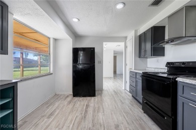 This affordable gem is perfect for a first-time homebuyer or on Port Charlotte Golf Club in Florida - for sale on GolfHomes.com, golf home, golf lot