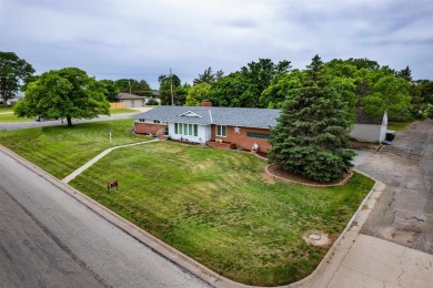 This stunning 4-bed, 3-bath ranch is perched directly across on Ellis Country Club in Kansas - for sale on GolfHomes.com, golf home, golf lot