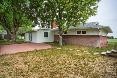 This stunning 4-bed, 3-bath ranch is perched directly across on Ellis Country Club in Kansas - for sale on GolfHomes.com, golf home, golf lot