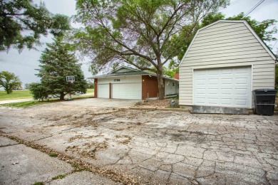 This stunning 4-bed, 3-bath ranch is perched directly across on Ellis Country Club in Kansas - for sale on GolfHomes.com, golf home, golf lot