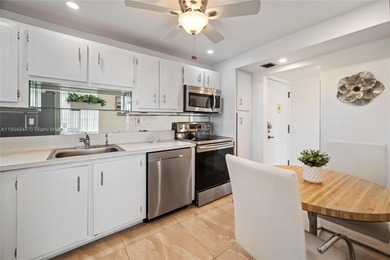 Stunning corner unit condo in the desirable Park Place 55+ on Pembroke Lakes Golf Club in Florida - for sale on GolfHomes.com, golf home, golf lot