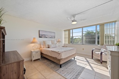 Stunning corner unit condo in the desirable Park Place 55+ on Pembroke Lakes Golf Club in Florida - for sale on GolfHomes.com, golf home, golf lot