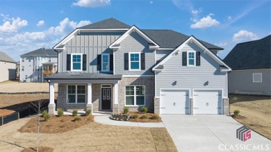 This Savannah plan offers a beautiful lake view from your on Long Shadow Golf Club in Georgia - for sale on GolfHomes.com, golf home, golf lot
