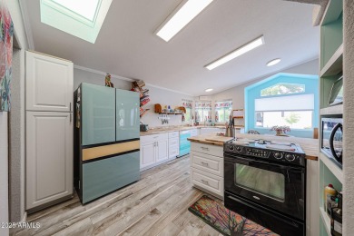 This beautifully updated home sits on an oversized lot and has on Paradise Peak Golf Course in Arizona - for sale on GolfHomes.com, golf home, golf lot