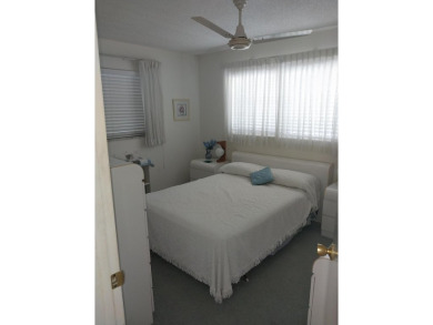 This 2/2 villa sits directly on the golf course which is free to on Leisureville Community Golf Course in Florida - for sale on GolfHomes.com, golf home, golf lot