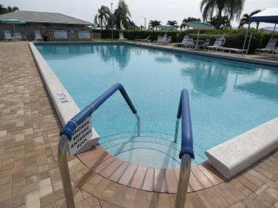 This 2/2 villa sits directly on the golf course which is free to on Leisureville Community Golf Course in Florida - for sale on GolfHomes.com, golf home, golf lot