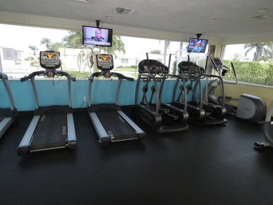 This 2/2 villa sits directly on the golf course which is free to on Leisureville Community Golf Course in Florida - for sale on GolfHomes.com, golf home, golf lot